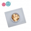 Fotografia, na której jest EZPZ Silikonowa miseczka z podkładką 2w1 Happy Bowl pastelowa szarość