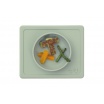 Fotografia, na której jest EZPZ Silikonowa miseczka z podkładką 2w1 Mini Bowl pastelowa zieleń